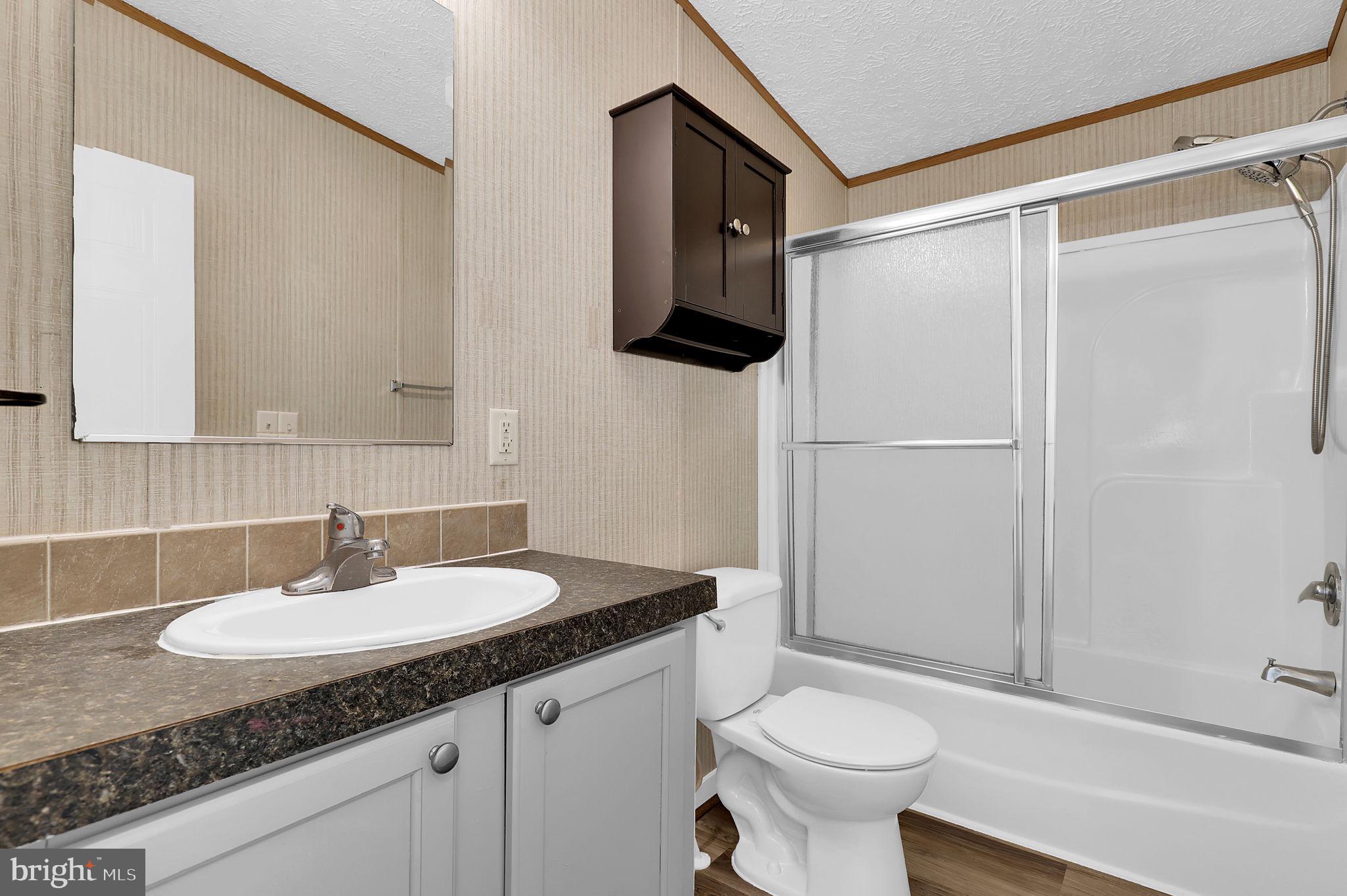 7810 Clark Road, Unit D88 Jessup, MD 20794 - Photo 21 of 30 a bathroom with a sink toilet and shower