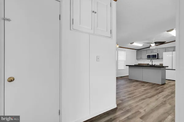 a view of kitchen with wooden floor