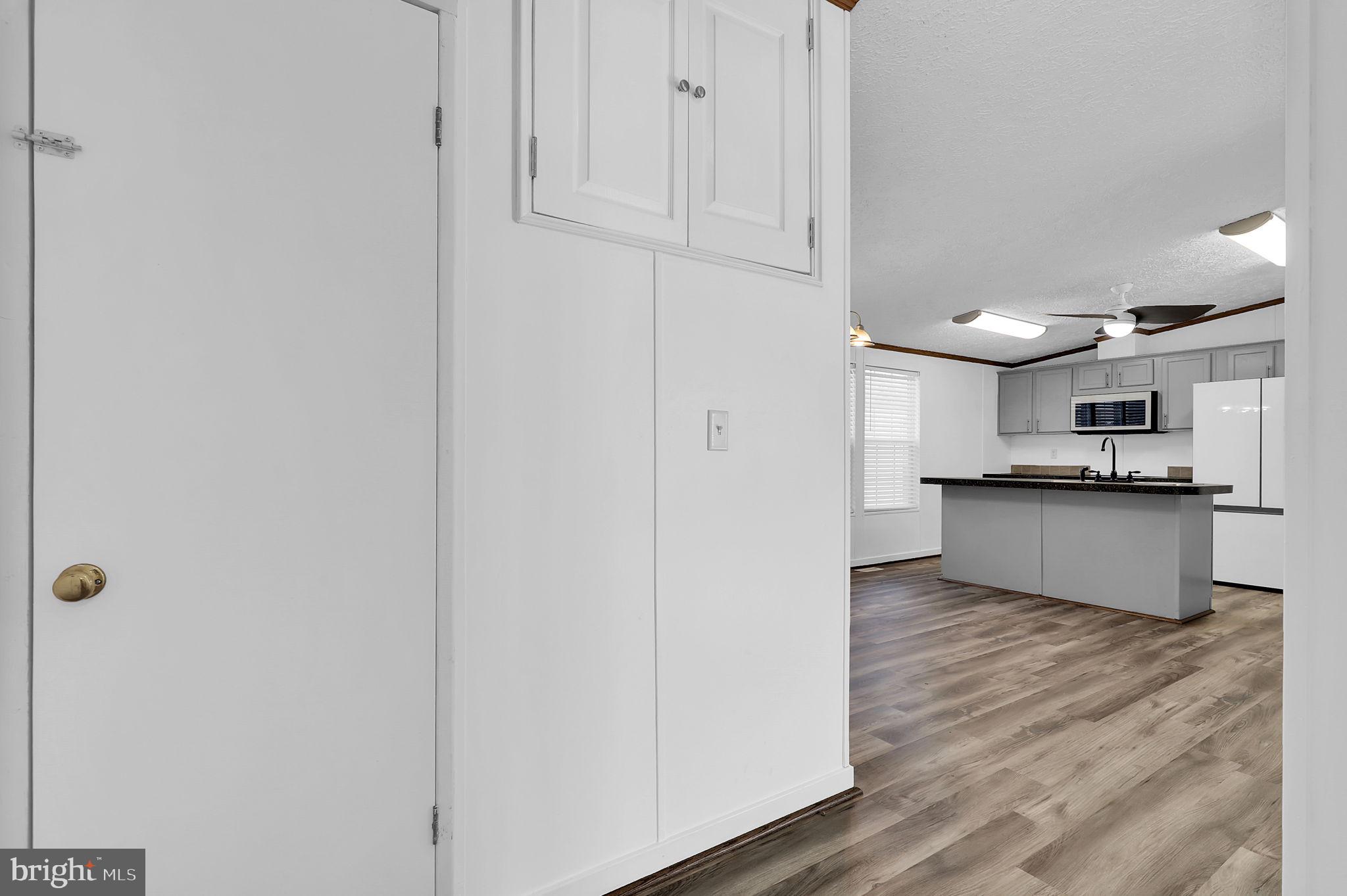 7810 Clark Road, Unit D88 Jessup, MD 20794 - Photo 23 of 30 a view of kitchen with wooden floor