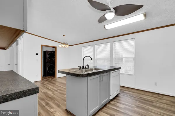 a kitchen with a sink and a refrigerator