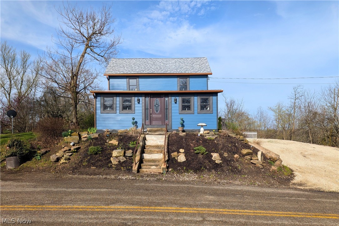 View of front of property with driveway