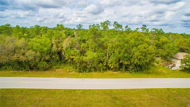 a view of a yard with an outdoor space
