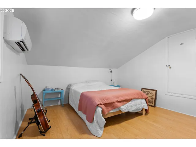 a bedroom with a bed and a cabinets