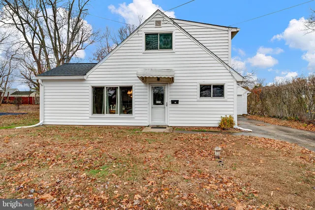 a house with trees in the background