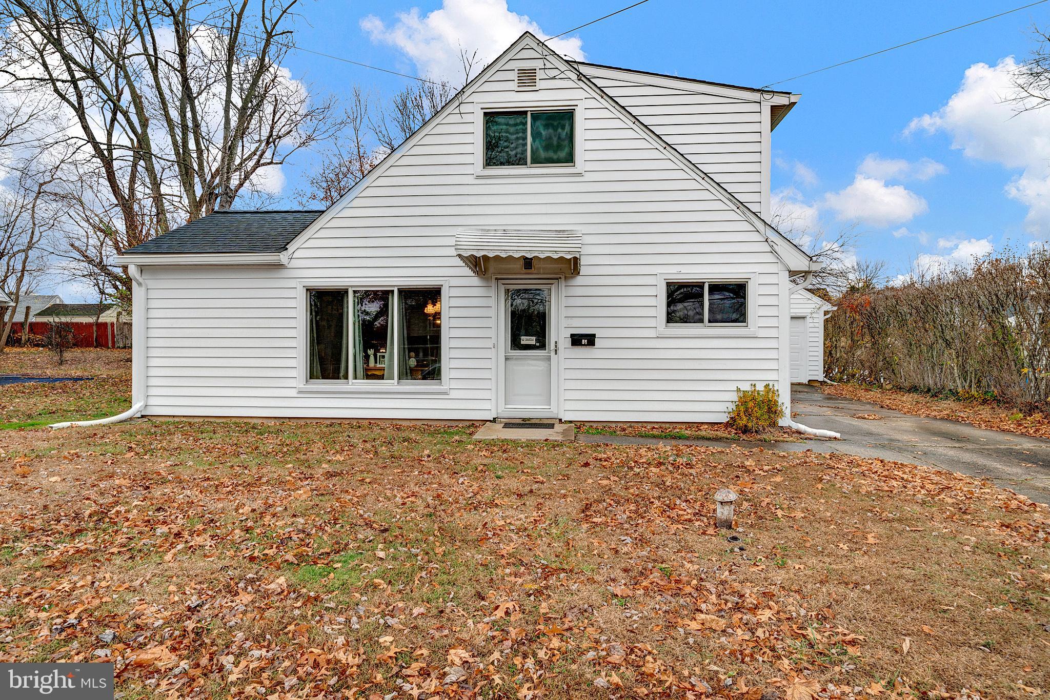 a house with trees in the background