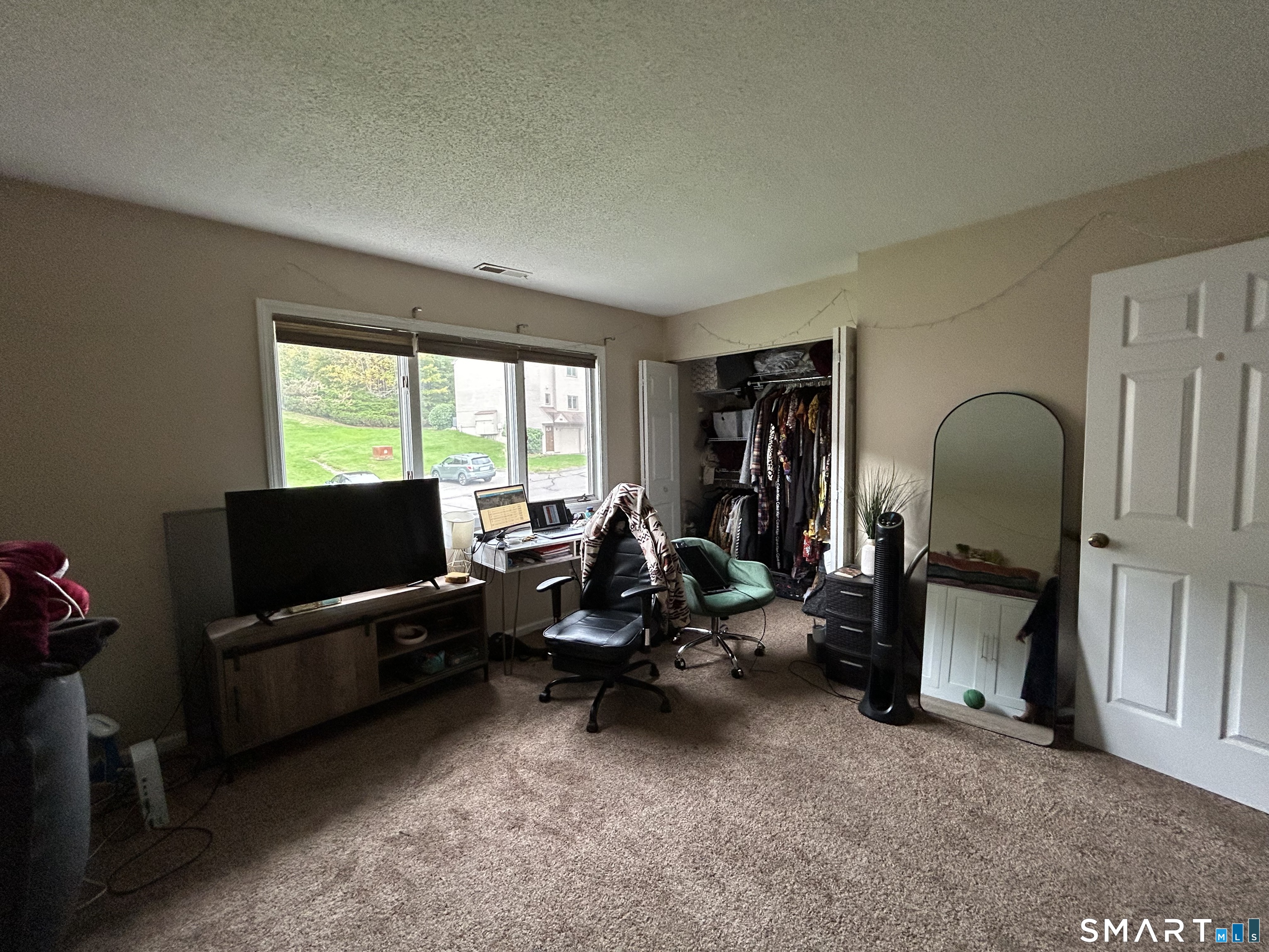 489 Wolcott Street, Unit 85 Bristol, CT 06010 - Photo 11 of 13 a view of a livingroom with workspace and a couch