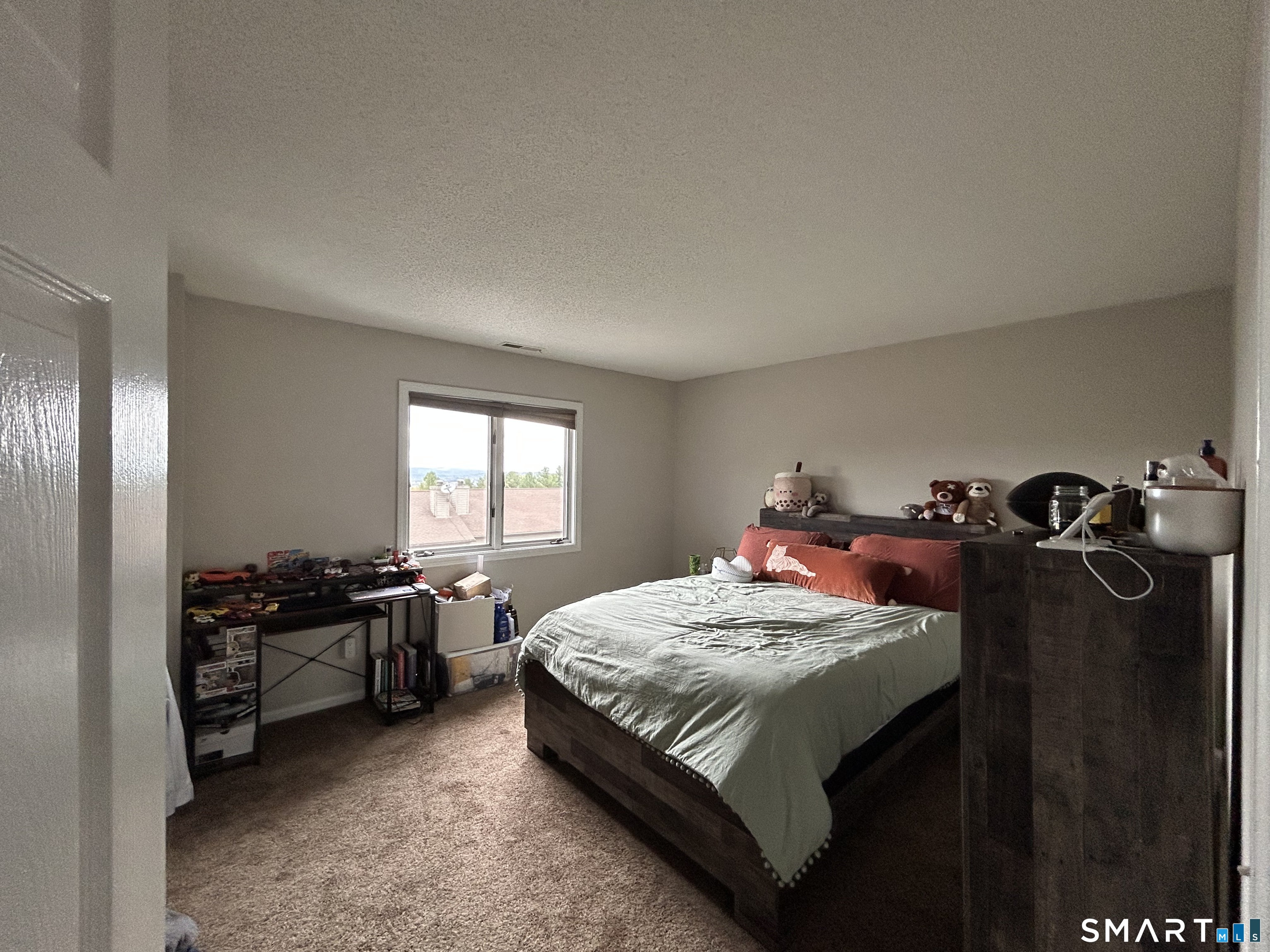 489 Wolcott Street, Unit 85 Bristol, CT 06010 - Photo 12 of 13 a bedroom with a bed and a window