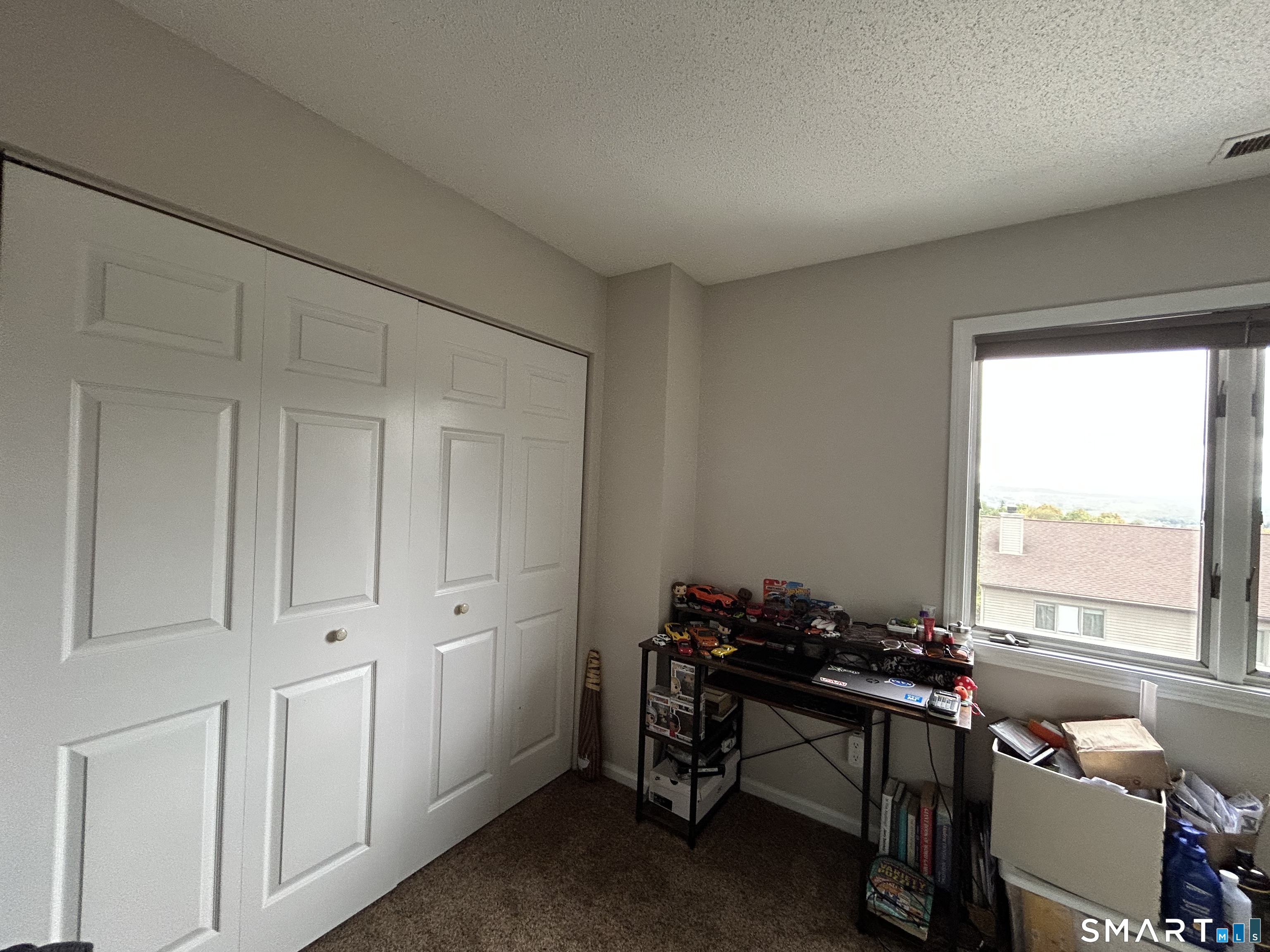 489 Wolcott Street, Unit 85 Bristol, CT 06010 - Photo 13 of 13 a view of a workspace with furniture and a window