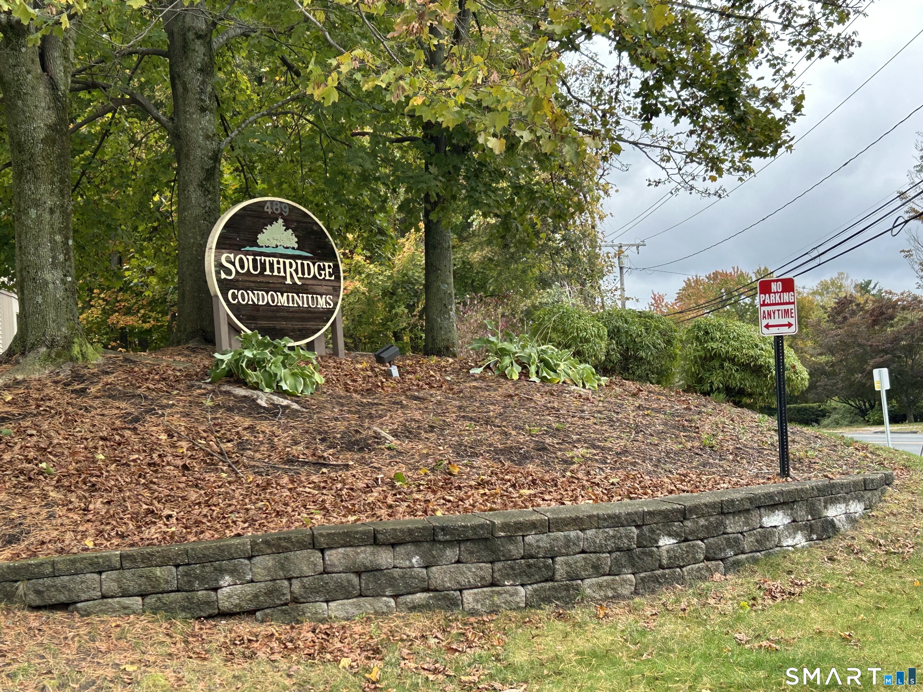 489 Wolcott Street, Unit 85 Bristol, CT 06010 - Photo 2 of 13 a backyard of a house with barbeque oven