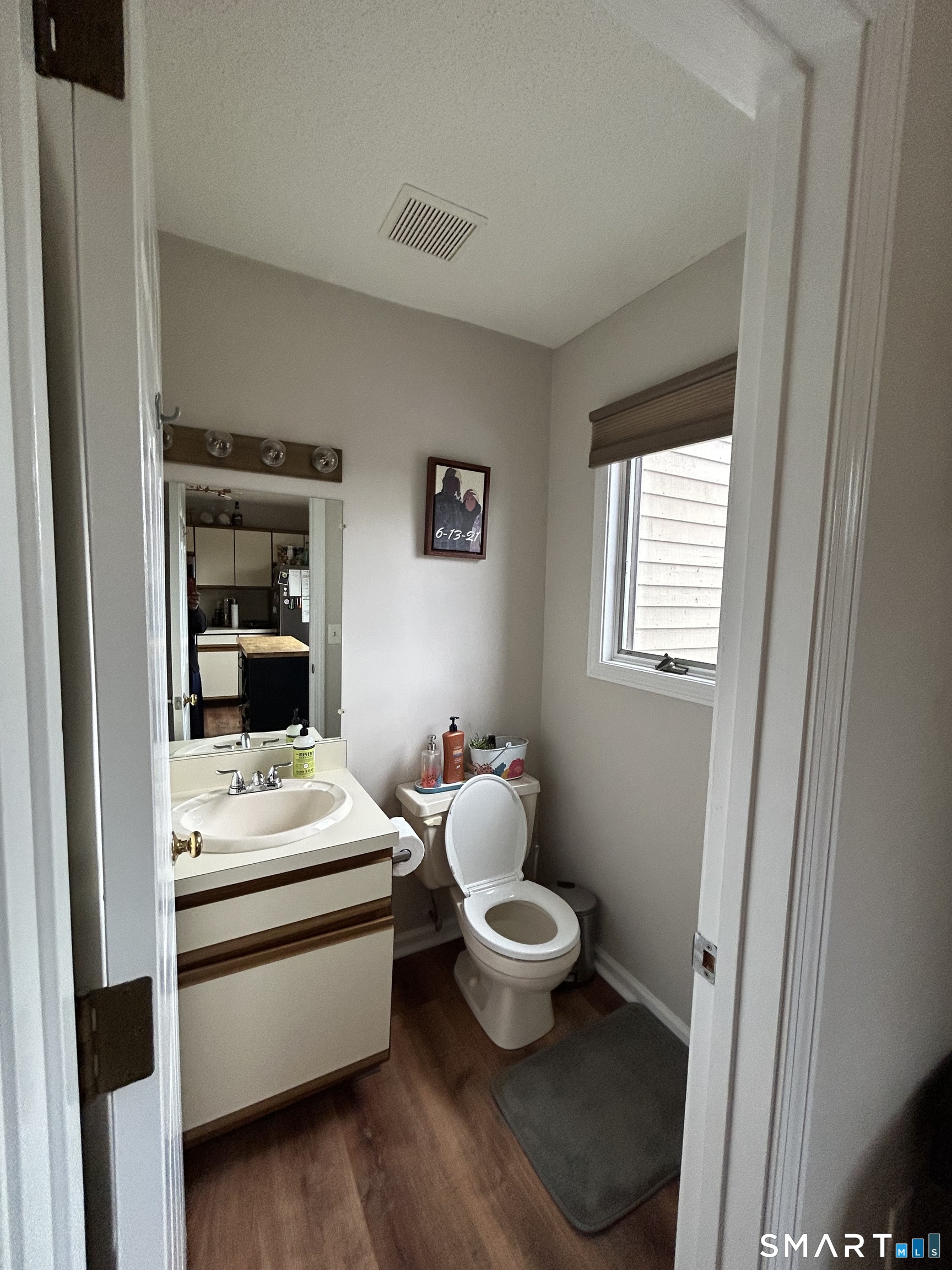 489 Wolcott Street, Unit 85 Bristol, CT 06010 - Photo 4 of 13 a bathroom with a white toilet sink and vanity