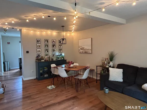 a view of a livingroom with furniture and a potted plant