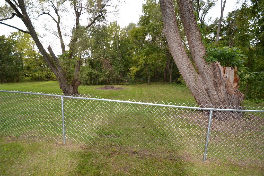 723 5 Mile Line Road Webster, NY 14580 - Photo 10 of 38 Property goes beyond fencing to wooded area