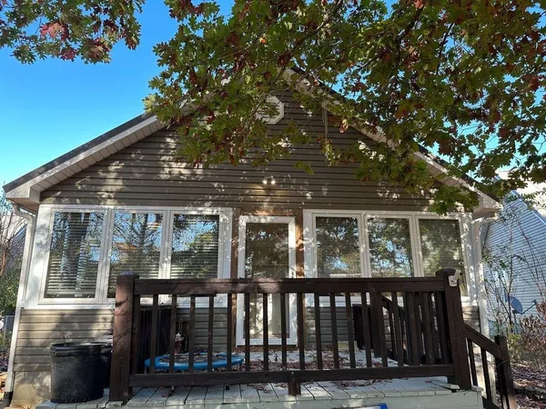 a view of house with a trees in the background