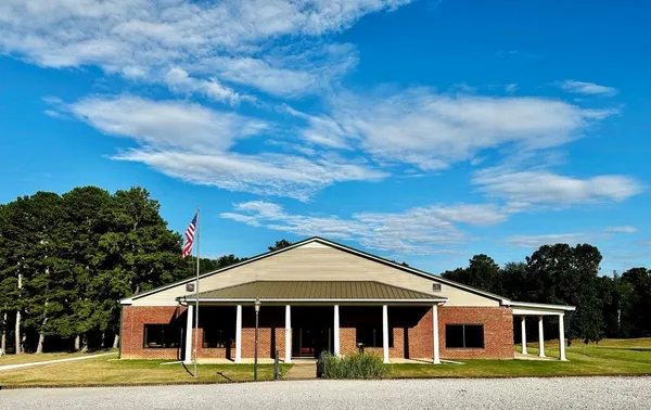 a view of a swimming pool with an outdoor seating