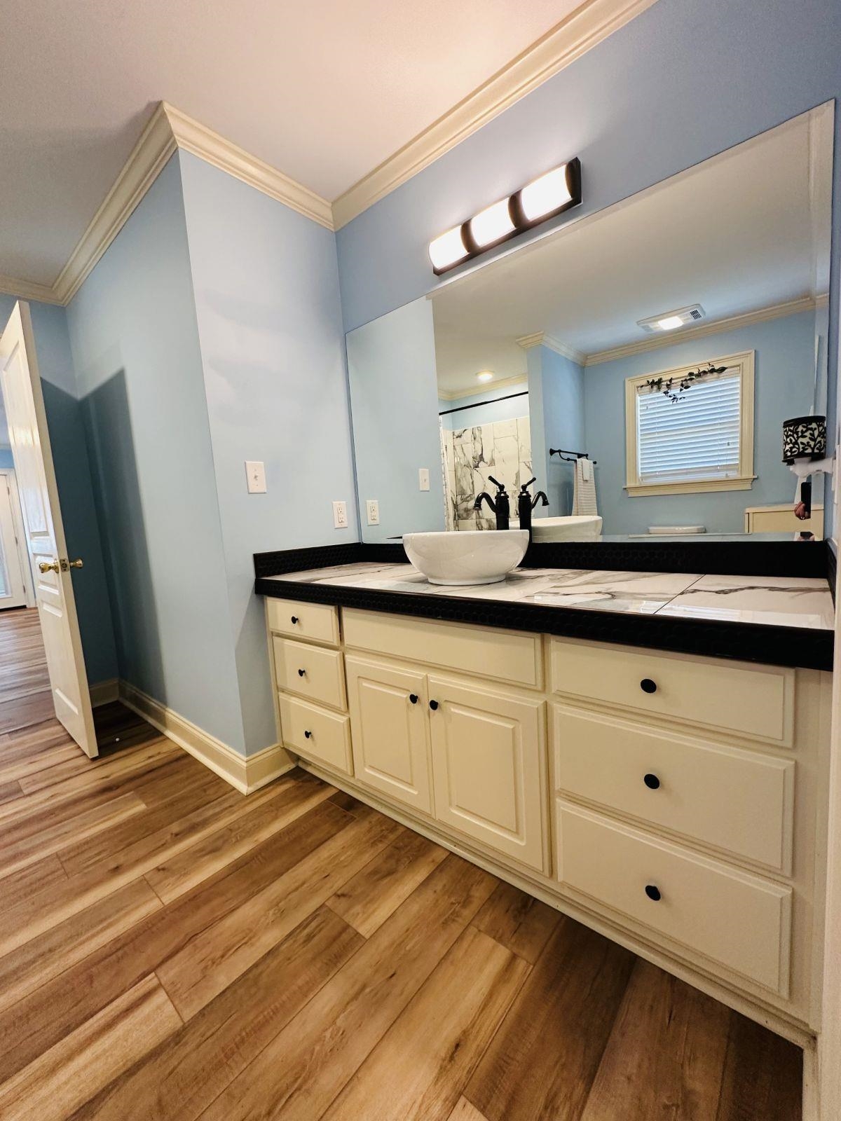 19 Pearl Parkway Iuka, MS 38852 - Photo 10 of 27 a spacious bathroom with a double vanity sink and mirror