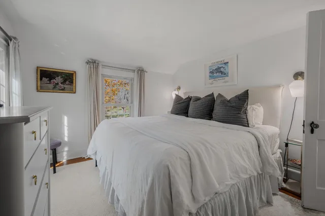 a bedroom with a bed and a closet