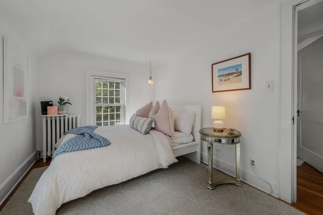 a view of dirt yard with a large tree