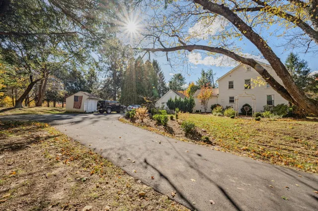 a view of a car parked in front of a house