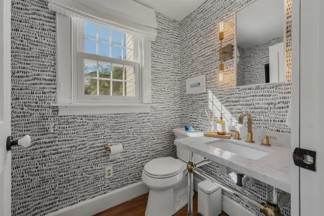 a kitchen with a sink cabinets and window