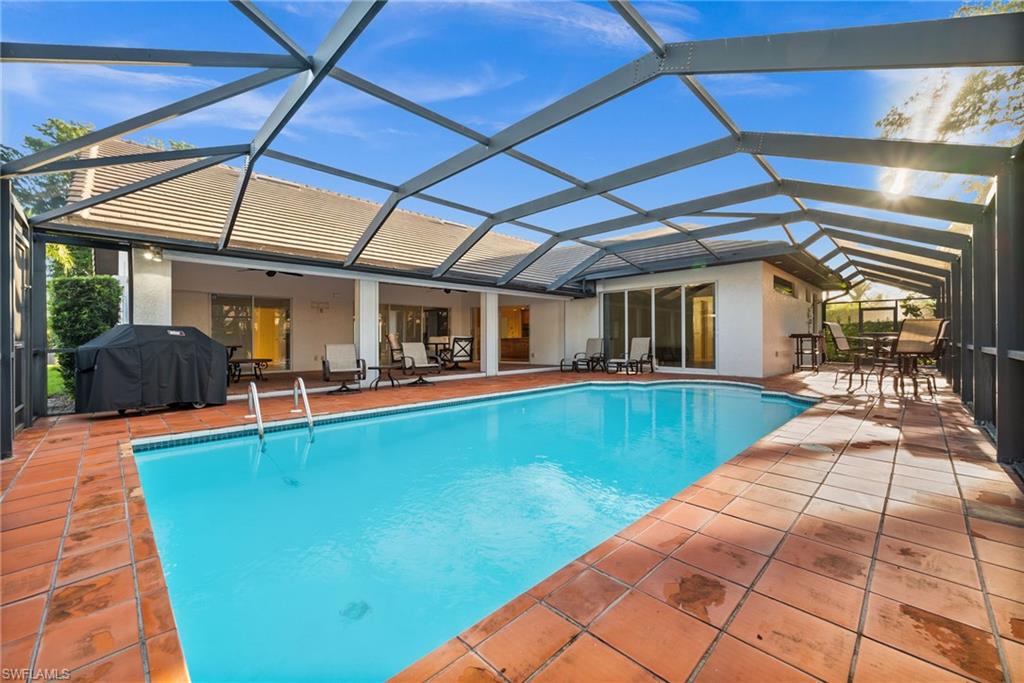 a view of a backyard with swimming pool