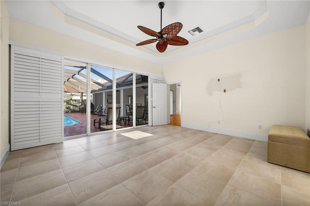 544 Roma Court Naples, FL 34110 - Photo 23 of 41 a view of a livingroom with a ceiling fan and window
