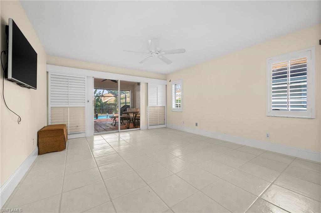 544 Roma Court Naples, FL 34110 - Photo 29 of 41 a view of a livingroom with furniture and a flat screen tv