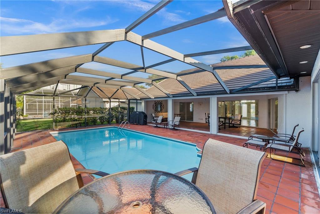 544 Roma Court Naples, FL 34110 - Photo 37 of 41 a view of a swimming pool with a patio
