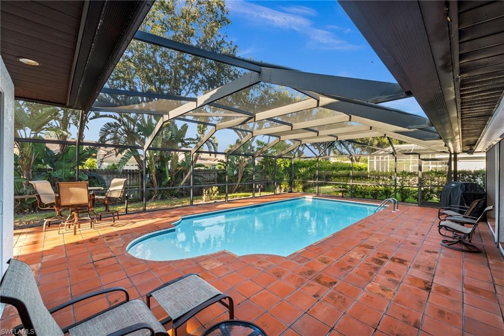 544 Roma Court Naples, FL 34110 - Photo 39 of 41 a view of swimming pool with outdoor seating and a patio