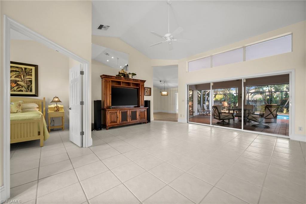 544 Roma Court Naples, FL 34110 - Photo 6 of 41 a view of a livingroom with furniture and a flat screen tv