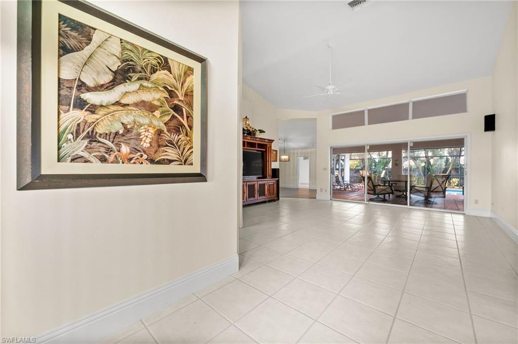 544 Roma Court Naples, FL 34110 - Photo 7 of 41 a view of an empty room with a window