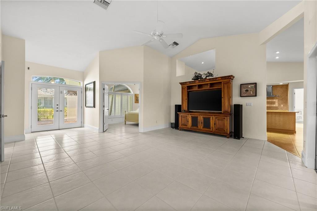 544 Roma Court Naples, FL 34110 - Photo 9 of 41 a living room with furniture and a flat screen tv