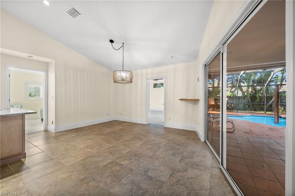 544 Roma Court Naples, FL 34110 - Photo 10 of 41 a view of an empty room with a window