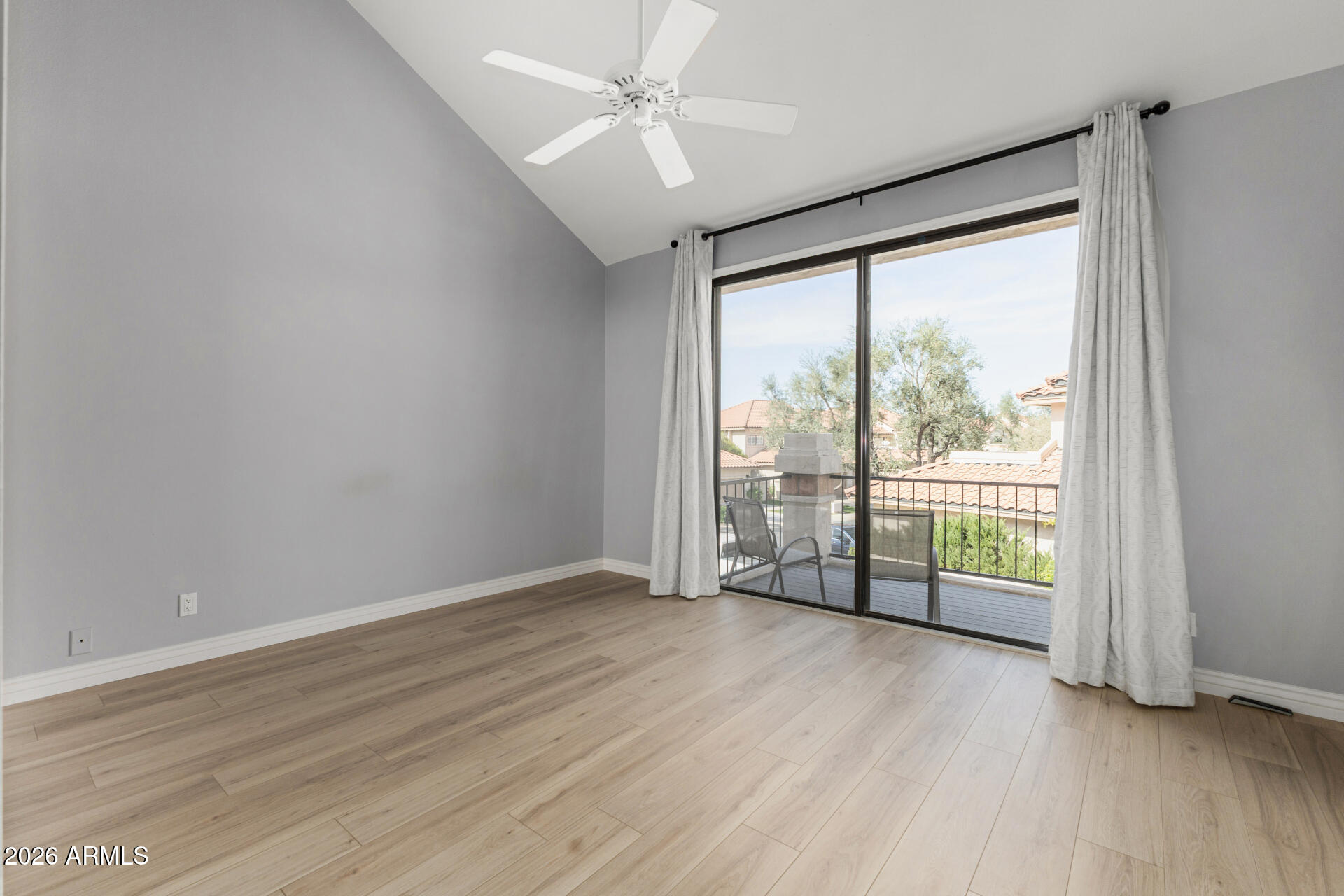 9705 East Mountain View Road, Unit 1126 Scottsdale, AZ 85258 - Photo 11 of 33 wooden floor in an empty room with a window