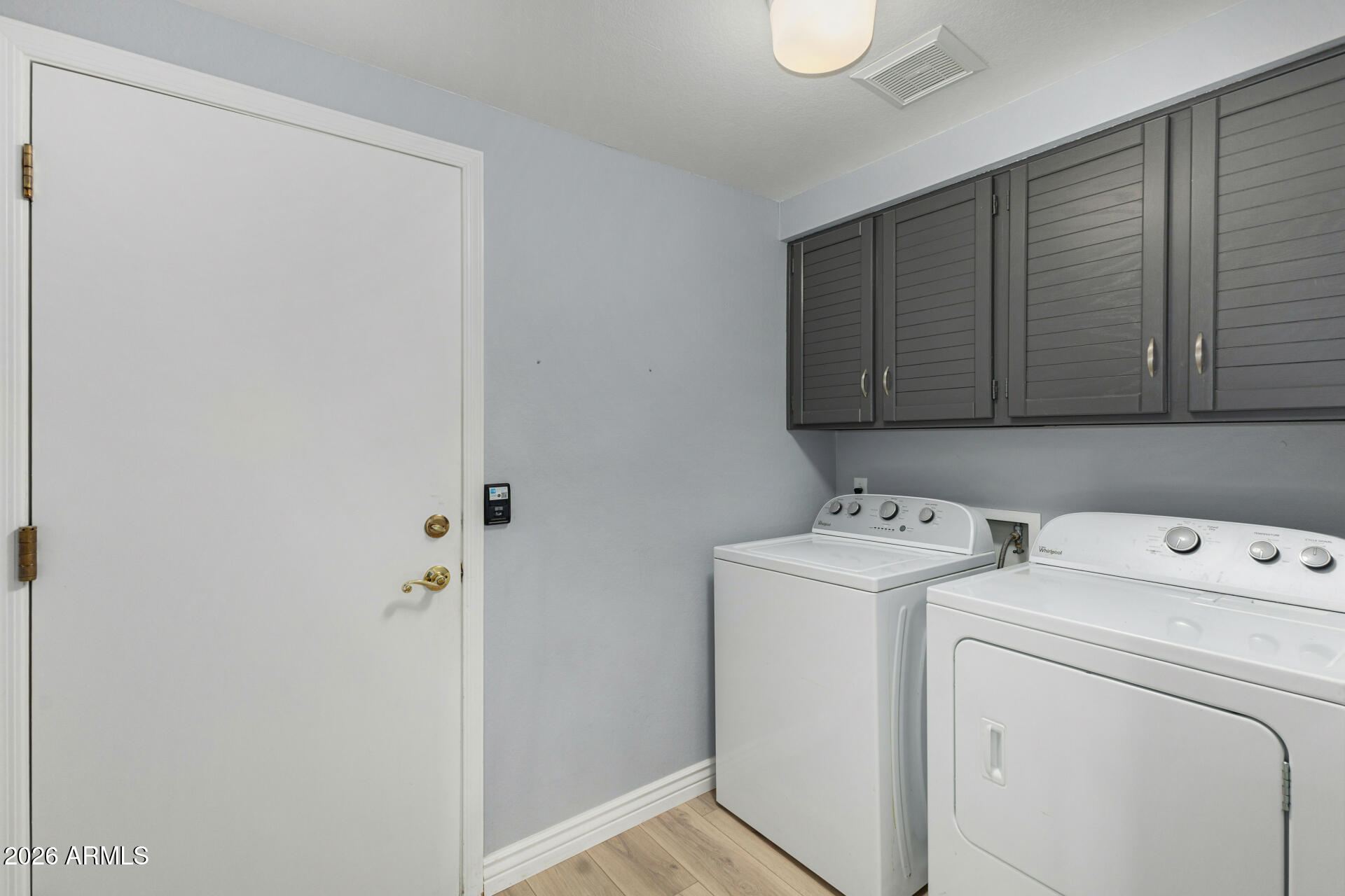 9705 East Mountain View Road, Unit 1126 Scottsdale, AZ 85258 - Photo 15 of 33 a view of storage and utility room with washer and dryer