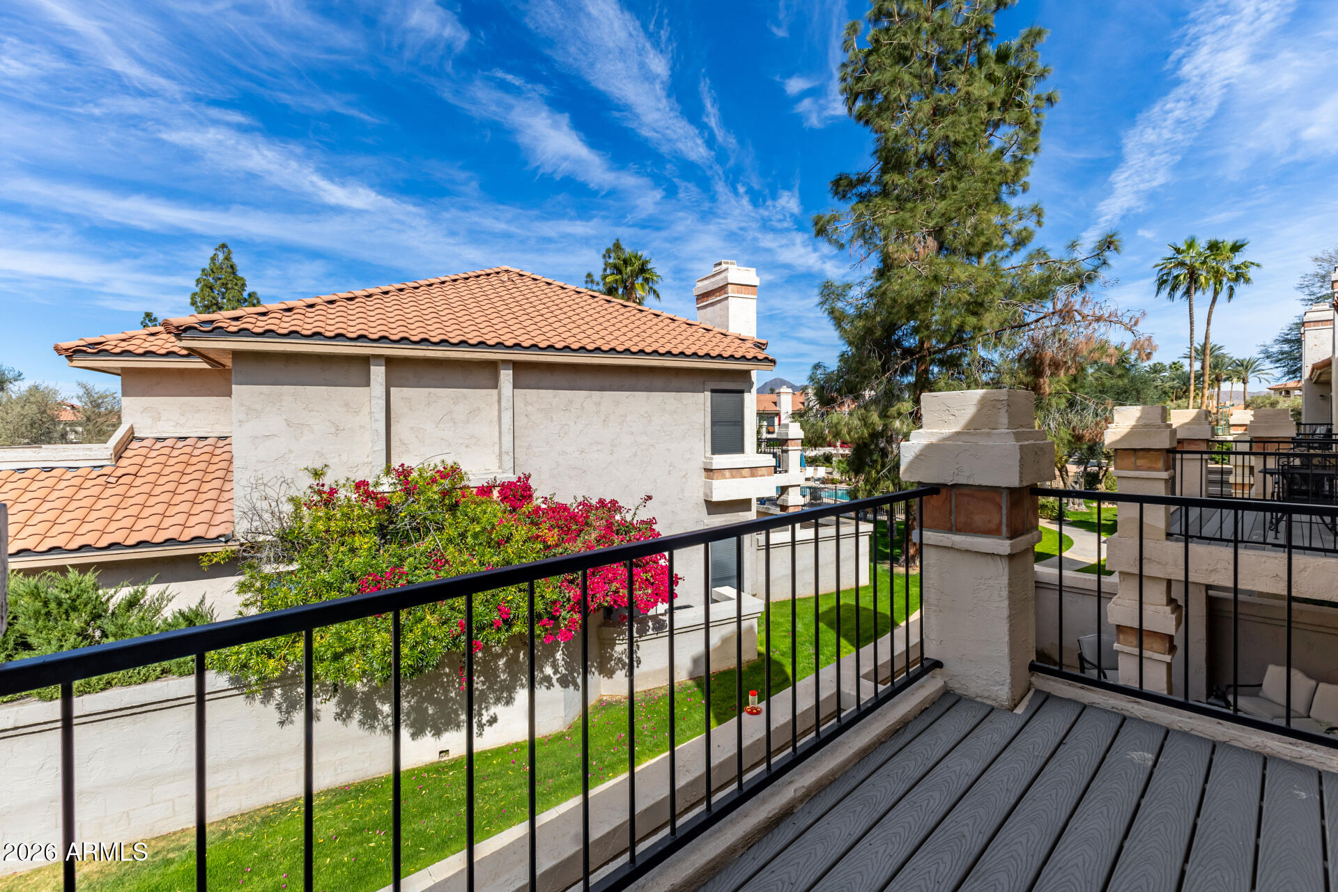 9705 East Mountain View Road, Unit 1126 Scottsdale, AZ 85258 - Photo 16 of 33 a view of a house with wooden fence