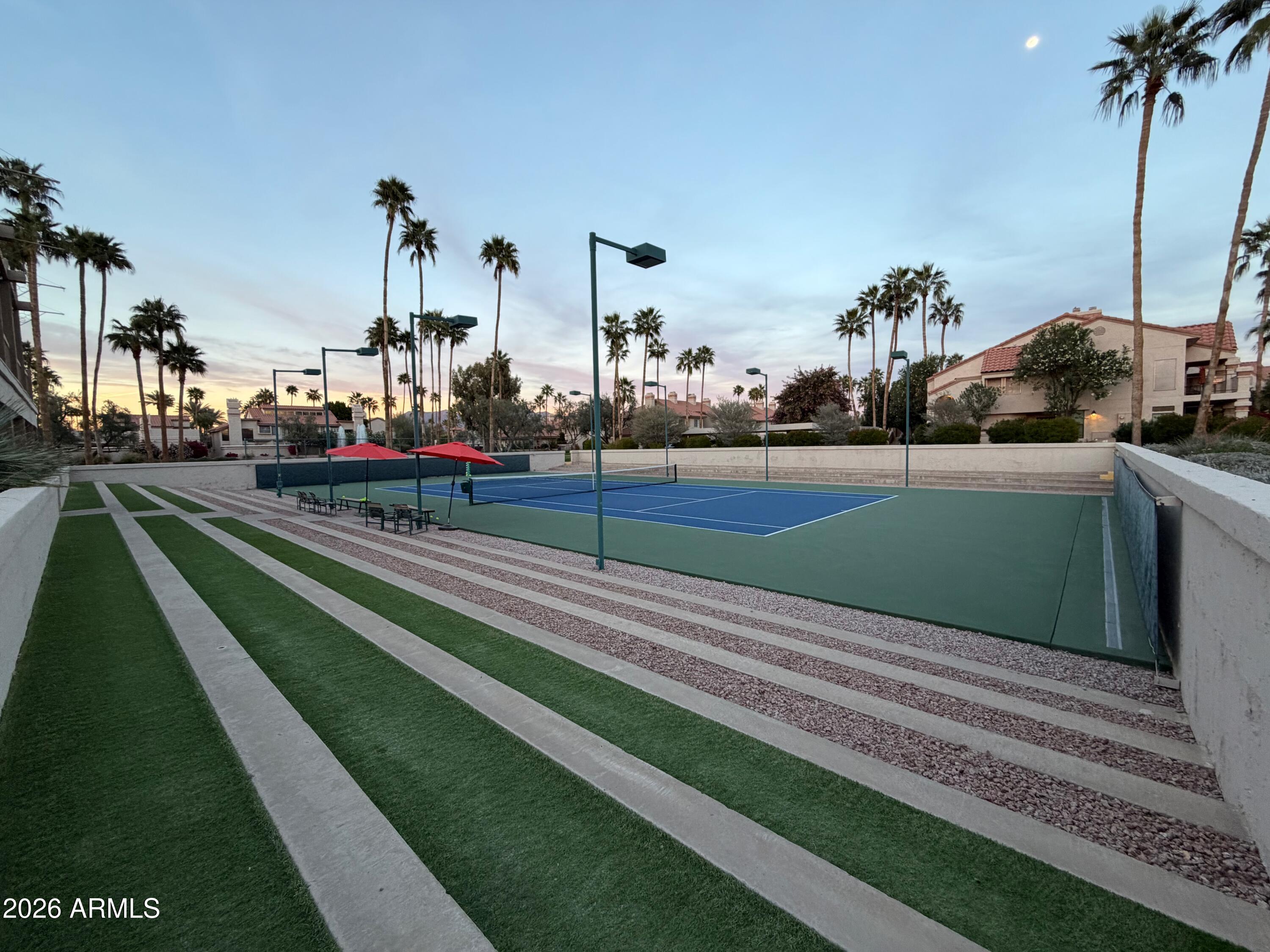 9705 East Mountain View Road, Unit 1126 Scottsdale, AZ 85258 - Photo 21 of 33 a view of a golf course with a lake view