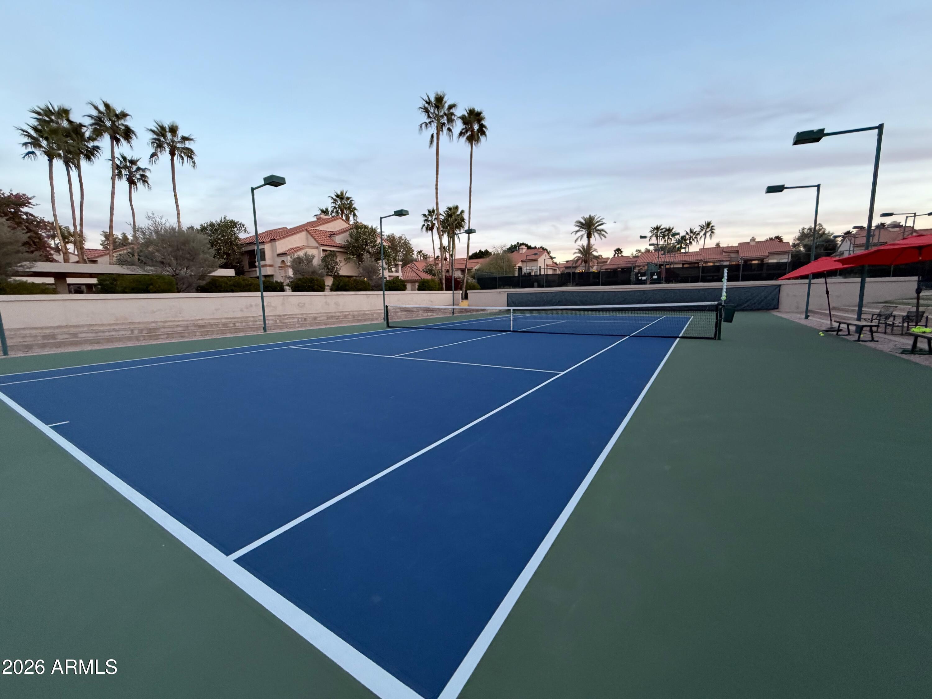 9705 East Mountain View Road, Unit 1126 Scottsdale, AZ 85258 - Photo 22 of 33 a terrace with outdoor seating and city view