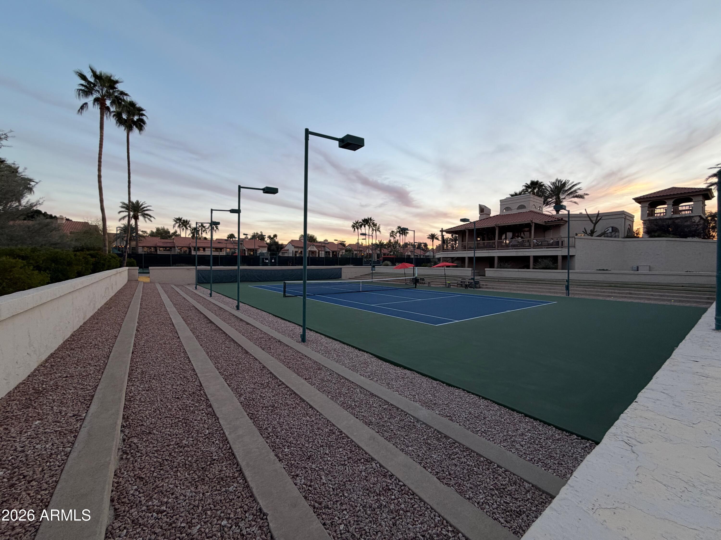 9705 East Mountain View Road, Unit 1126 Scottsdale, AZ 85258 - Photo 24 of 33 a view of a terrace with wooden fence