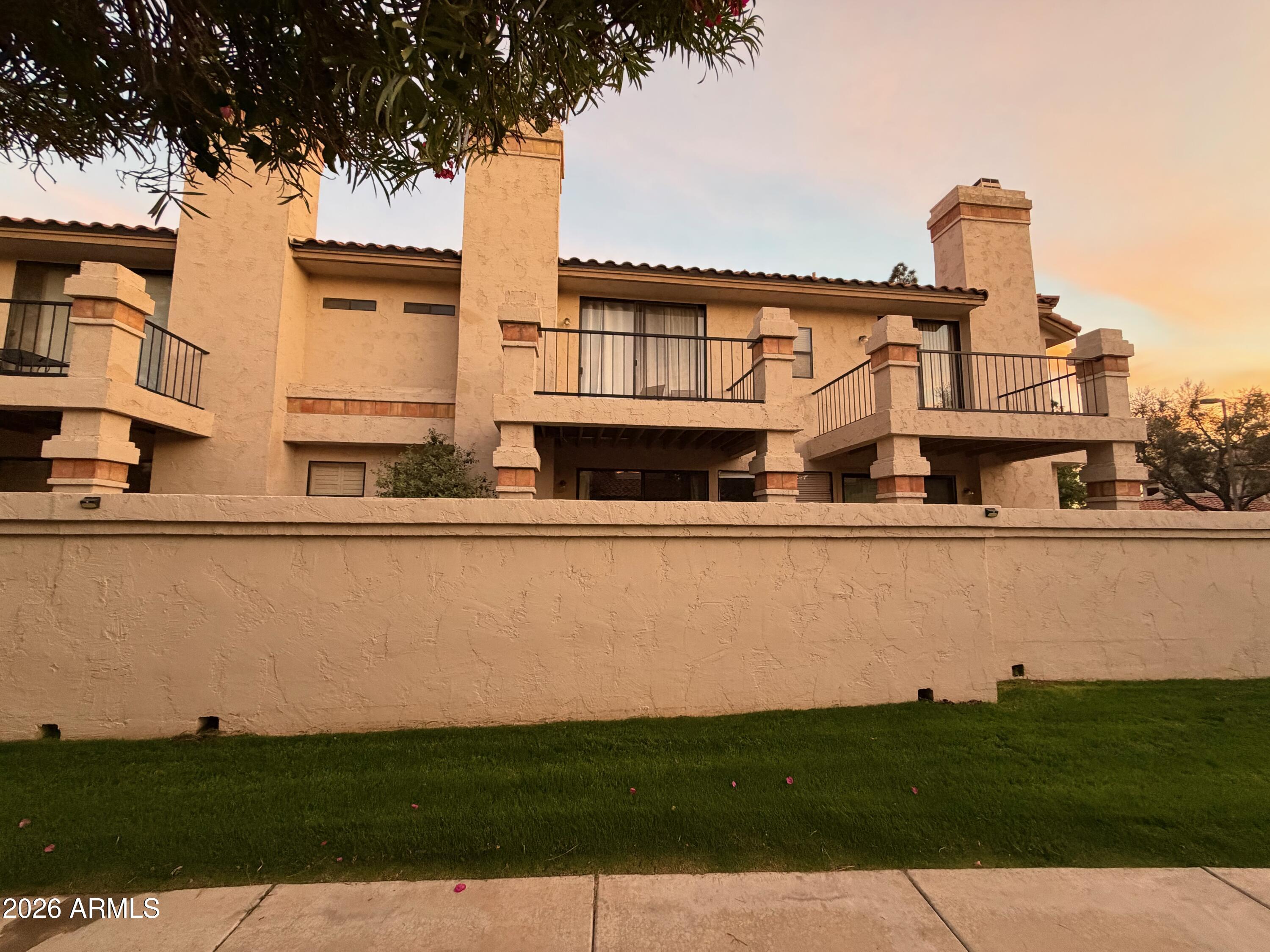 9705 East Mountain View Road, Unit 1126 Scottsdale, AZ 85258 - Photo 29 of 33 a house view with a garden space