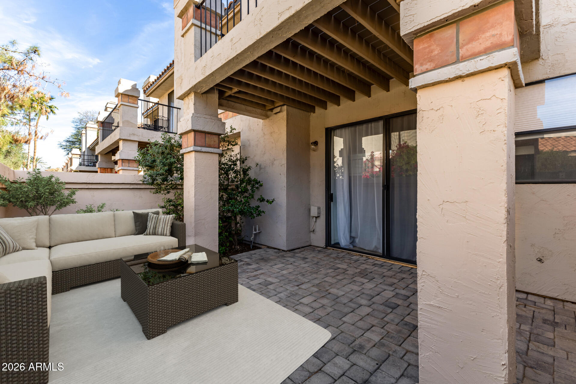 9705 East Mountain View Road, Unit 1126 Scottsdale, AZ 85258 - Photo 10 of 33 a view of a patio with couches and potted plants