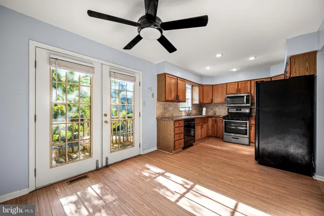 a balcony with wooden floor and fence