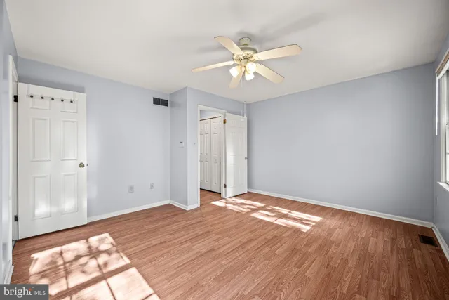 a bathroom with a granite countertop tub sink double vanity shower and a mirror