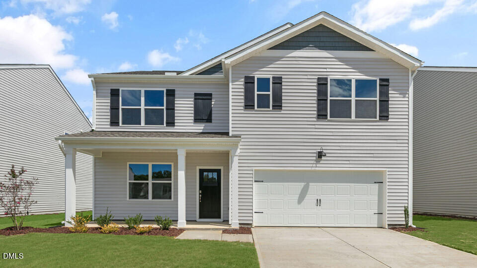 72 Westerly Way Lillington, NC 27546 - Photo 1 of 36 a front view of a house with a yard