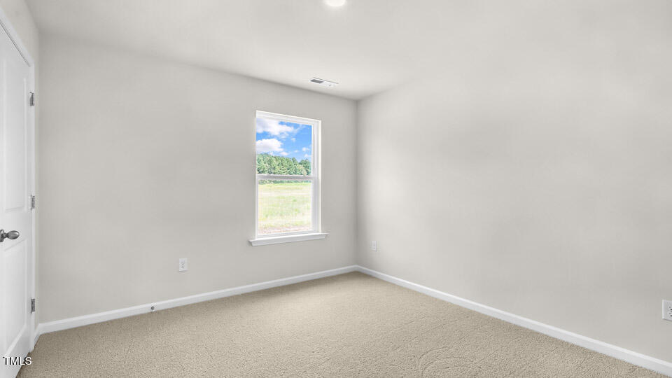 72 Westerly Way Lillington, NC 27546 - Photo 25 of 36 an empty room with a window