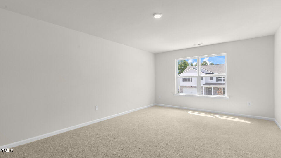 72 Westerly Way Lillington, NC 27546 - Photo 26 of 36 an empty room with a window