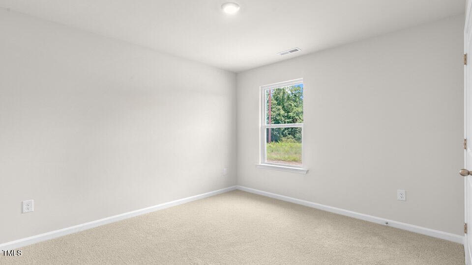 72 Westerly Way Lillington, NC 27546 - Photo 27 of 36 an empty room with windows