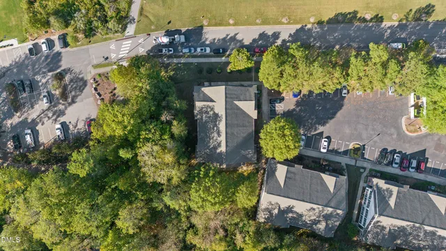an aerial view of residential house with outdoor space and swimming pool