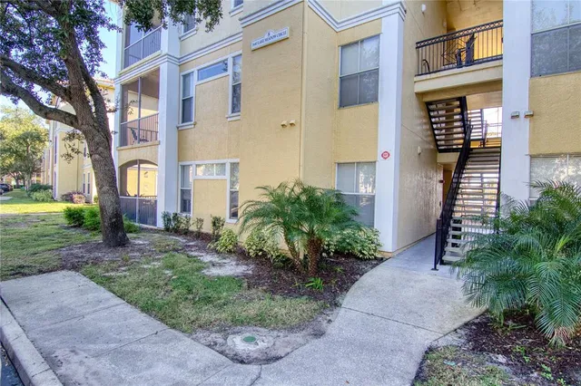 a view of a building with a yard