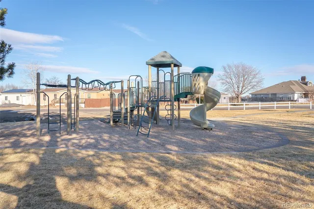 a view of a water fountain in front of a house