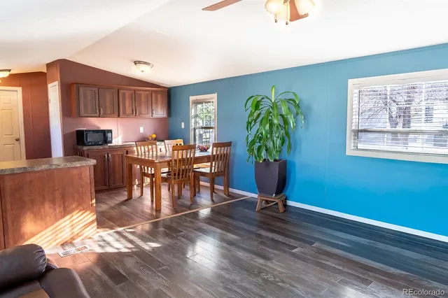 a living room with furniture a window and appliances